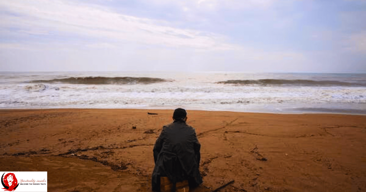 a person feeling lost and hopeless on a beach